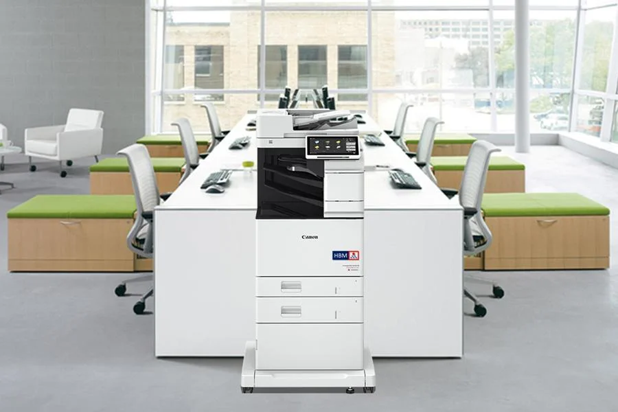 imageRUNNER ADVANCE DX C568iF in the office with 2 paper drawers and cabinet